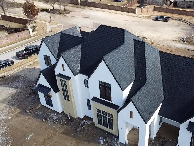 White modern home with a Euroshield rubber composite roof